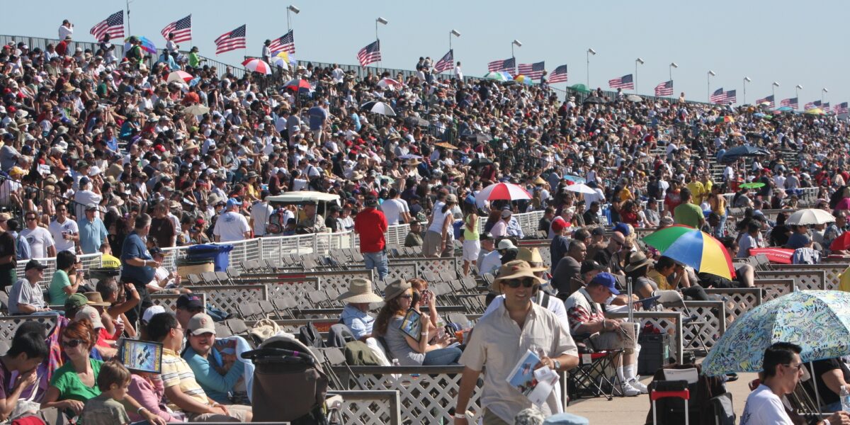 Spectators watching an air show from grandstand seating at MCAS Miramar