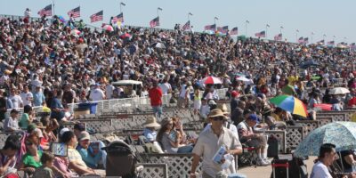 Spectators watching an air show from grandstand seating at MCAS Miramar